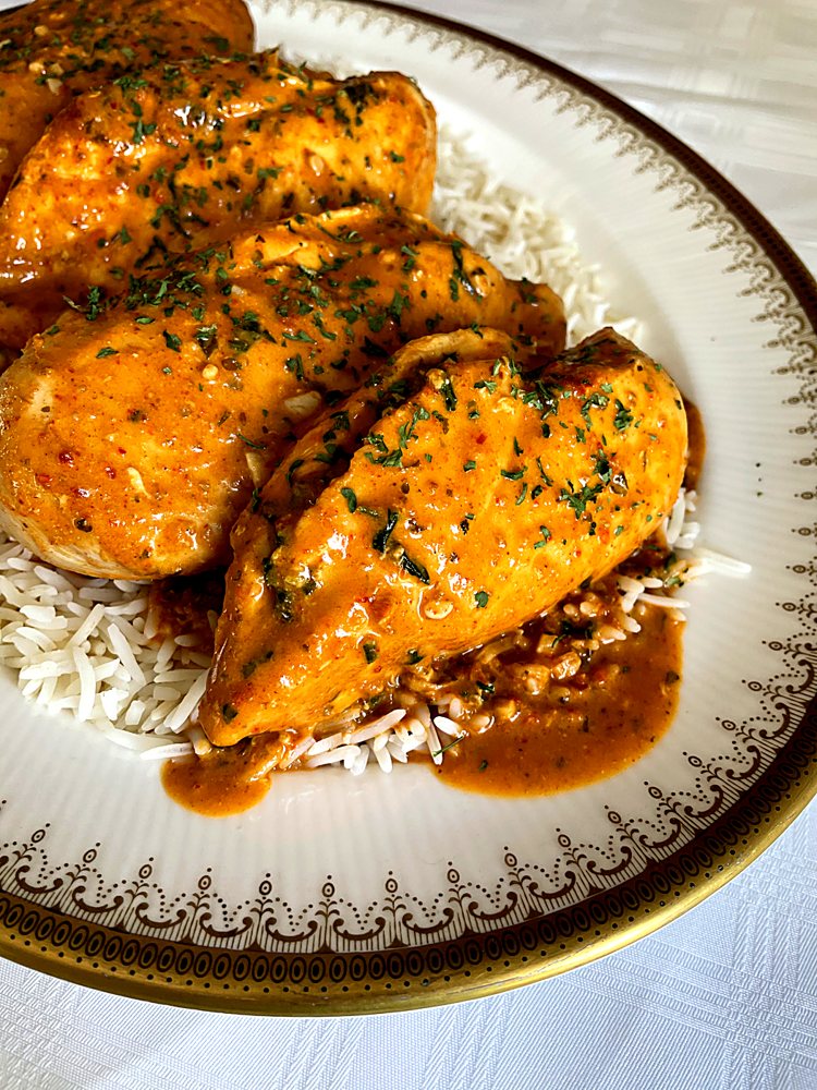 Chicken in sauce on rice